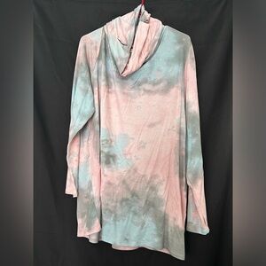 Ladies long sleeve top with holes for thumbs and holes to use as a face shield.